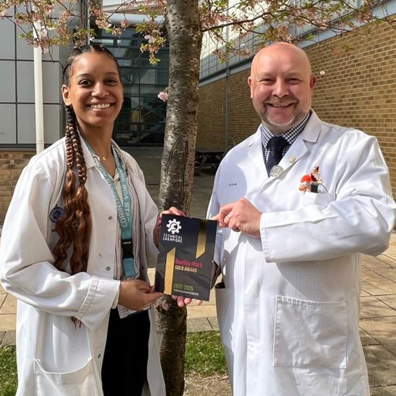 Paul Cook recieving a gold award